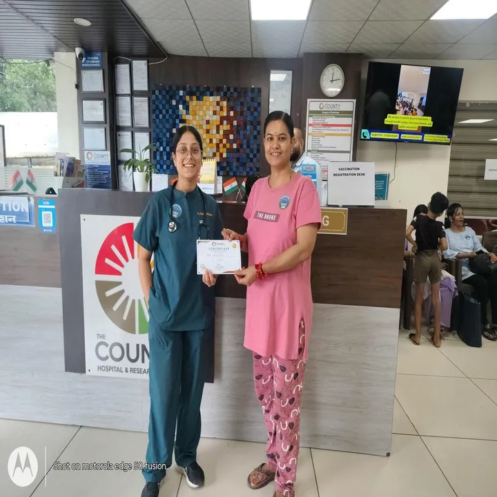 Visitors at the reception counter during the vaccination drive, certificates in hand